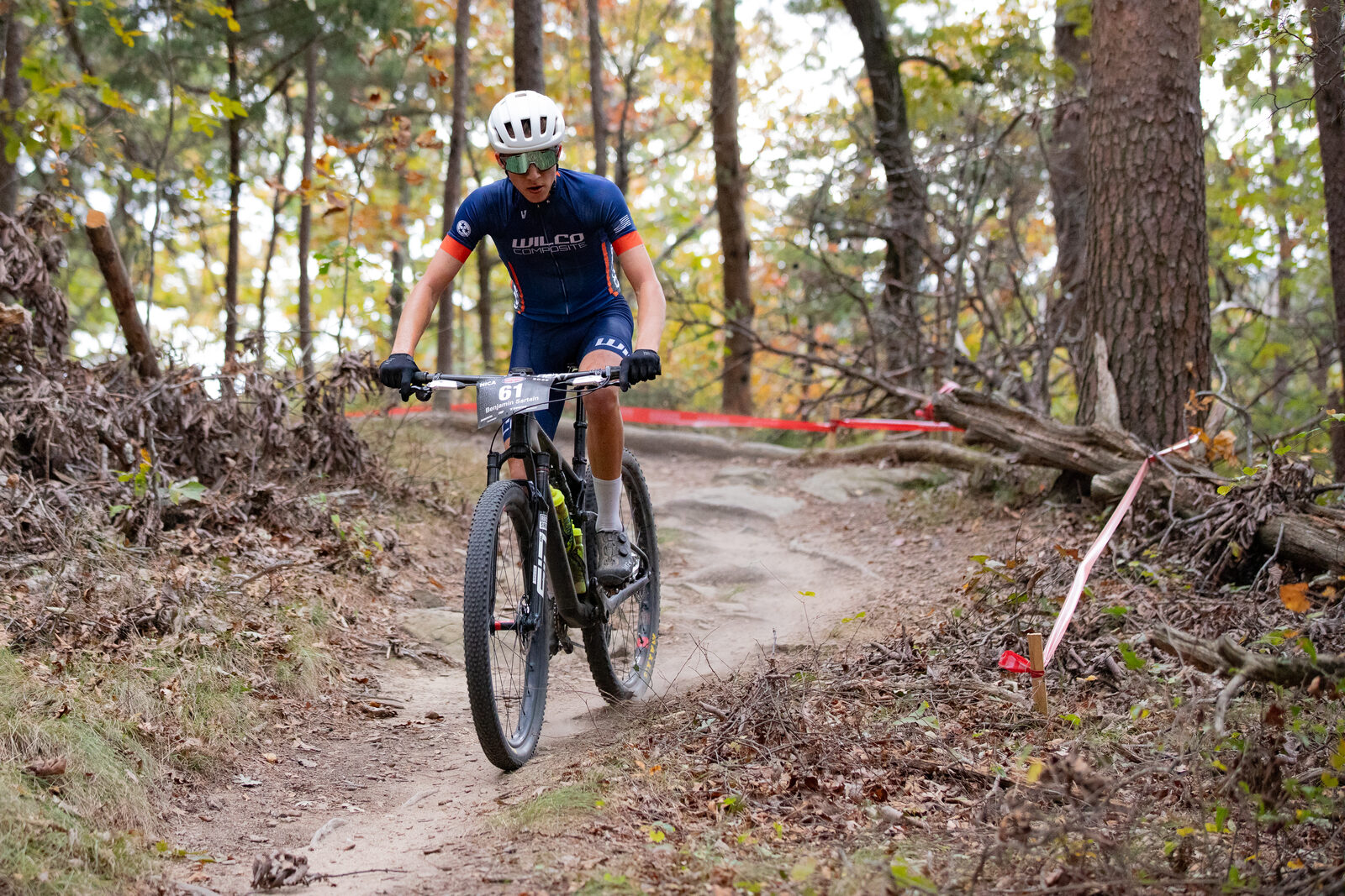A Wilco coach carving a wooded berm on the race course